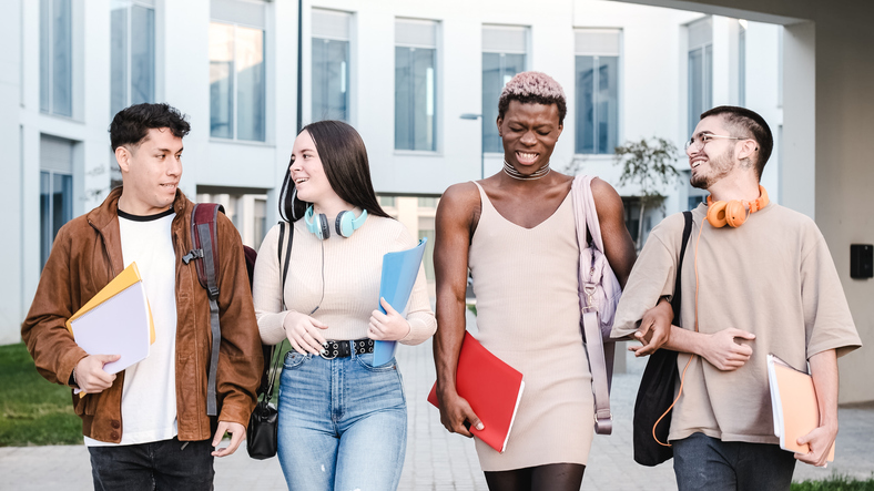 four students walk together